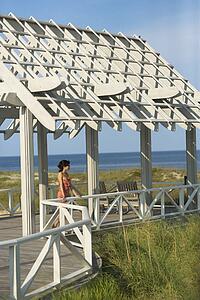 Woman on arbor looking at Ocean