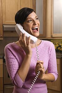 Happy woman talking on phone