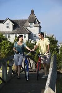 Couple on bridge with bicycles