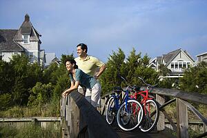 Couple on bridge with bicycles