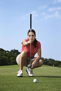 Female Golfer Concentrating