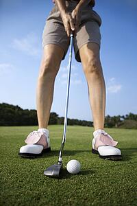Adult Female Golfing