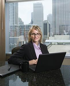 Smiling Businesswoman with Laptop