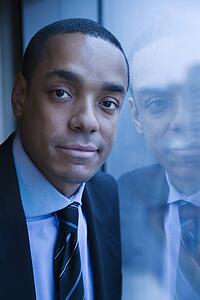 Portrait of Businessman and His Reflection