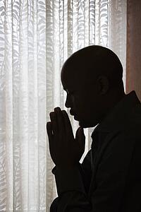 Man With Hands in Prayer