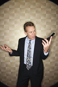 Angry Businessman on Cell Phone