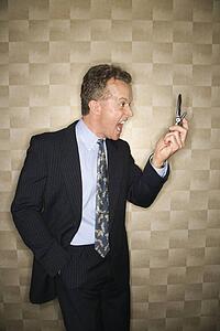 Businessman Yelling at Cell Phone