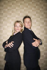 Business Man and Woman Back to Back