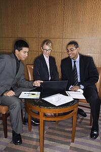 Businesspeople Looking at Laptop