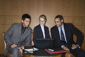 Businesspeople Looking at Laptop