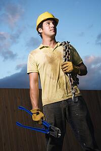 Construction Worker with Bolt Cutters and Chain