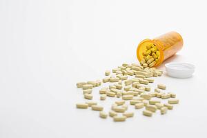 Pills Spilling From Bottle. Isolated