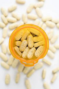 Open Pill Bottle with Tablets