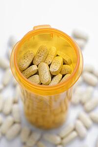 Open Pill Bottle with Tablets