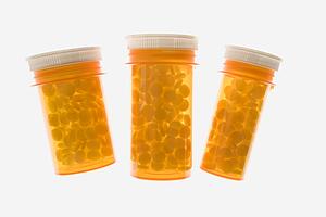 Three Yellow Plastic Medicine Bottles