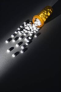 Yellow Medicine Bottle Spilling Pills