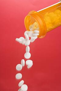 Pills Pouring From a Container