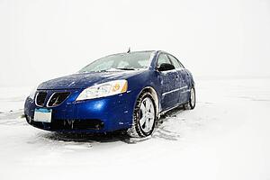 Sedan Parked on Ice sheet
