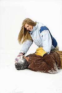 Young Couple Playing in Snow