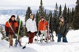 Skiers Standing in Snow Smiling