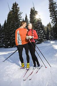 Cross Country Snow Skiers Smiling at Each Other