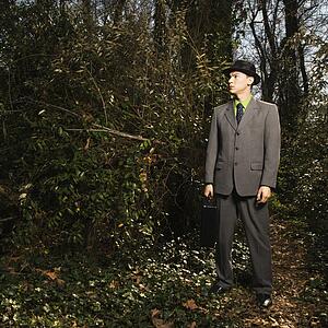Young Businessman in Woods