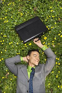 Smiling Businessman in Flower Patch