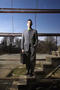 Young Businessman Standing on Stairs