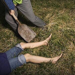 Businessman Burying Dead Body