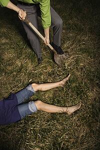 Businessman Burying Dead Body