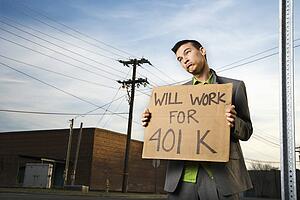 Young Businessman Holding 401k Sign