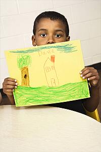 Boy Holding Drawing