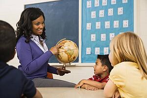 Teacher Holding Globe
