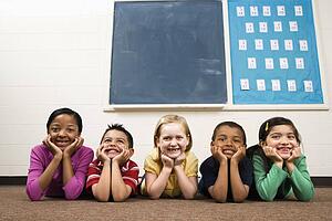 Students Lying on Floor in Classroom. 