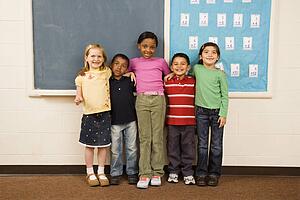 Students Standing in Classroom. 