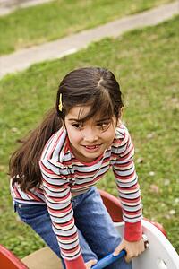 Young Girl Playing on Playground