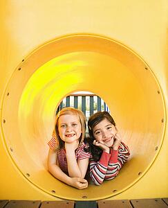 Young Girls Lying Together in Crawl Tube