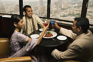 People Toasting in Restaurant