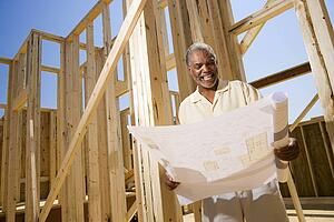 Man Holding Building Plans