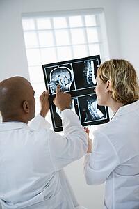 Doctors analyzing xray.