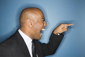 Businessman yelling and pointing