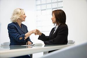 Businesswomen shaking hands