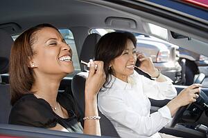 Laughing women in car