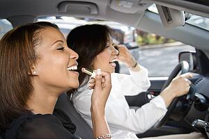 Women friends in car.