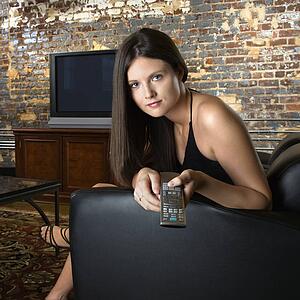 Woman holding remote control