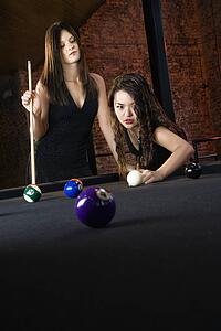Women playing pool