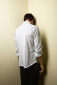 Man standing in corner