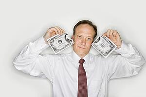 Businessman ripping money