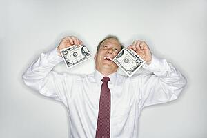 Businessman wasting money