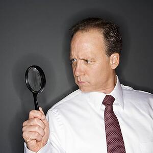 Businessman with magnifying glass